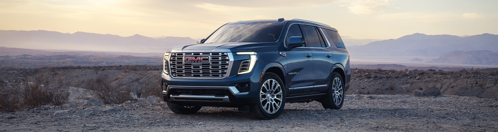 A GMC Yukon in the mountains.